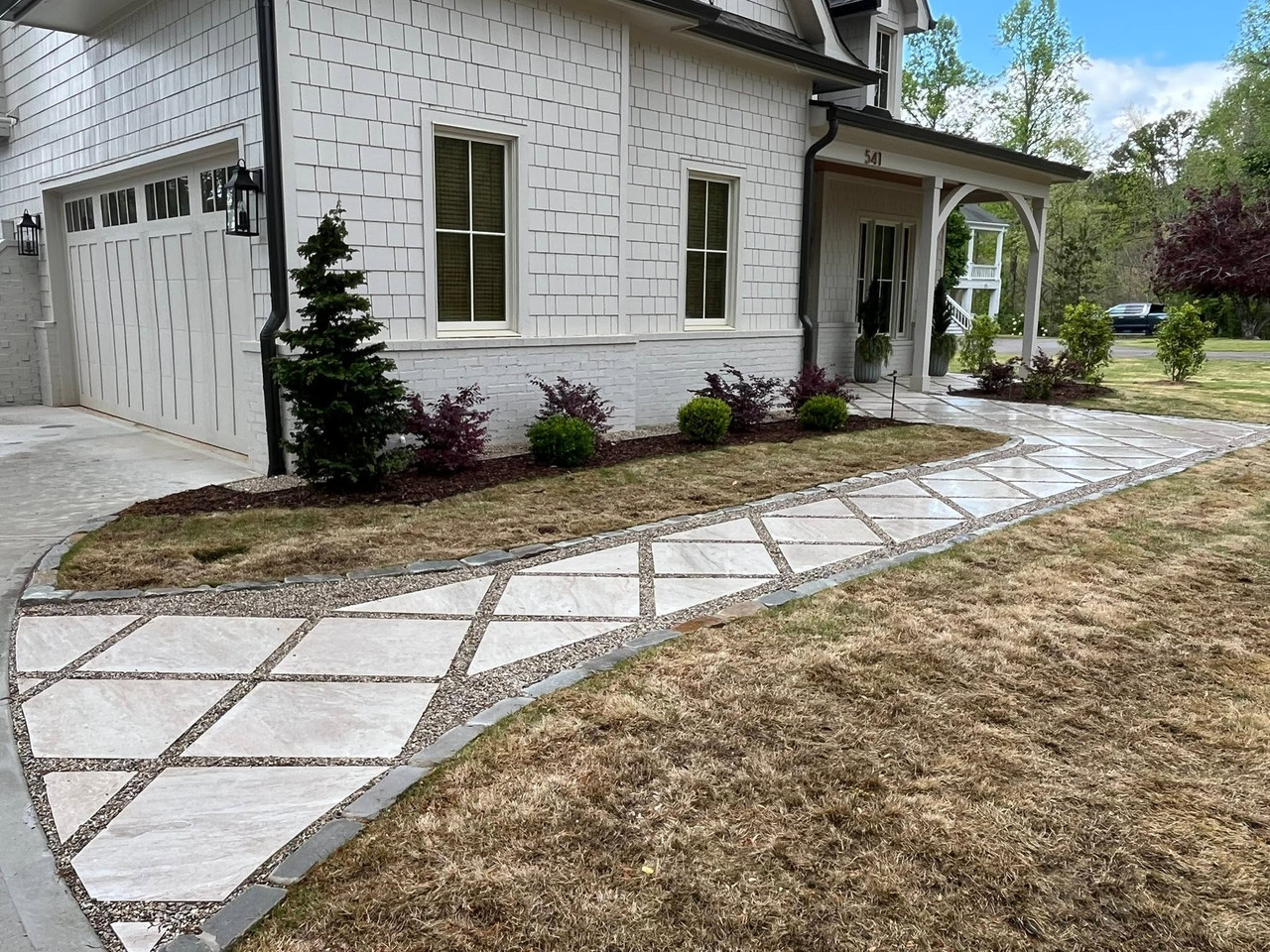 Natural stone terrace on a wooded lot